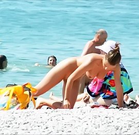 busty beach babe gets covered in cum