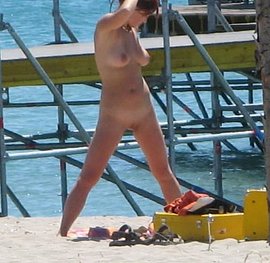 lying naked on the beach unaware pics